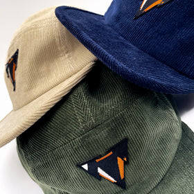 green navy and light beige fine corduroy 5 panels hats with JCKR logo embroidered patch on the front
