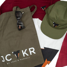 Bordeaux t-shirt, green tote bag with sunglasses, green cap, and JCKR logo t-shirt