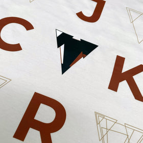 White loose fit JCKR t-shirt with brown letters and geometric shapes on a white background