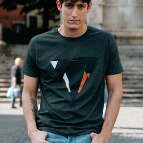 Man wearing the JUNE dark heather gret t-shirt from JCKR Clothing with the classic printed logo
