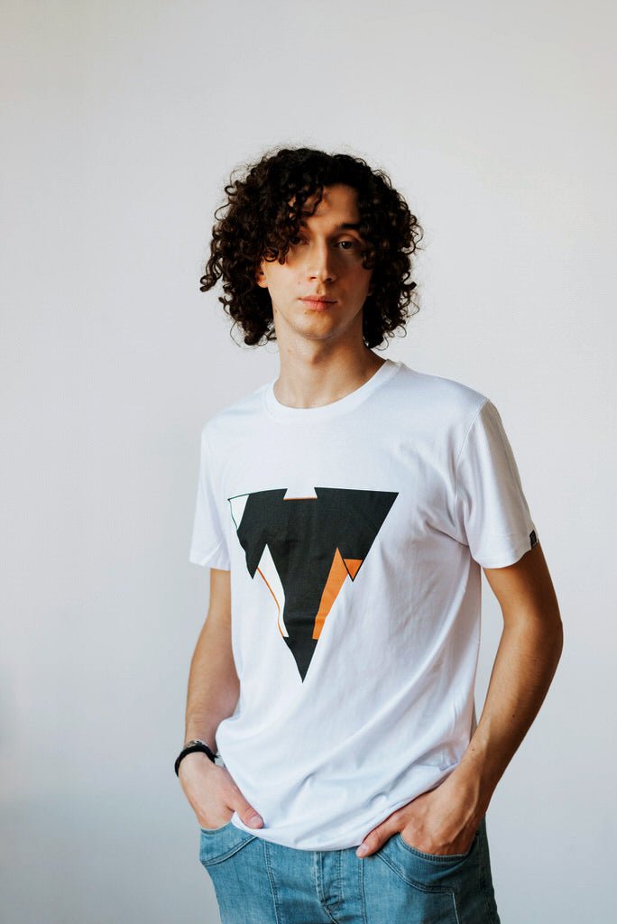 Man wearing the JUNE organic cotton in white t-shirt from JCKR Clothing with the classic printed logo