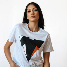 Woman wearing the JUNE white t-shirt from JCKR Clothing with the classic printed logo