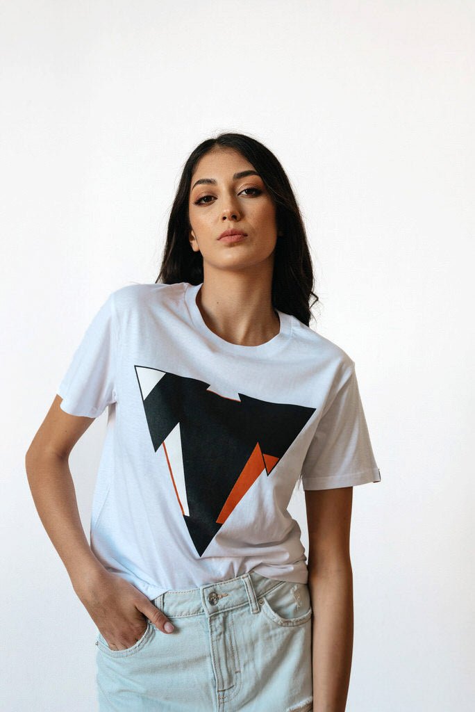 Woman wearing the JUNE white t-shirt from JCKR Clothing with the classic printed logo