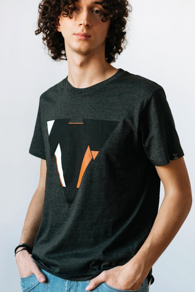 Man wearing the JUNE dark heather gret t-shirt from JCKR Clothing with the classic printed logo