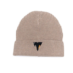 Beige knit fisherman beanie with a small embroidered JCKR logo on a white background