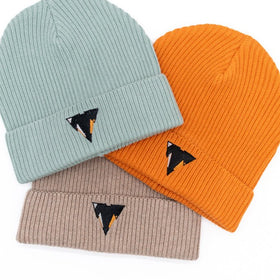 Three PEREC beanies in aloe, orange, and beige with the embroidered JCKR logo on a white background