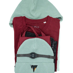 Stack of folded clothes including a bordeaux t-shirt, aloe green JCKR hoodie, and aloe green beanie from JCKR Clothing