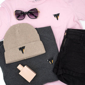 Pink JAM t-shirt with black shorts, beige beanie, sunglasses, and RUSSELL sweater in heather grey from JCKR clothing
